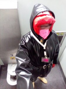 Parking lot fag fully geard in the toilet cabin